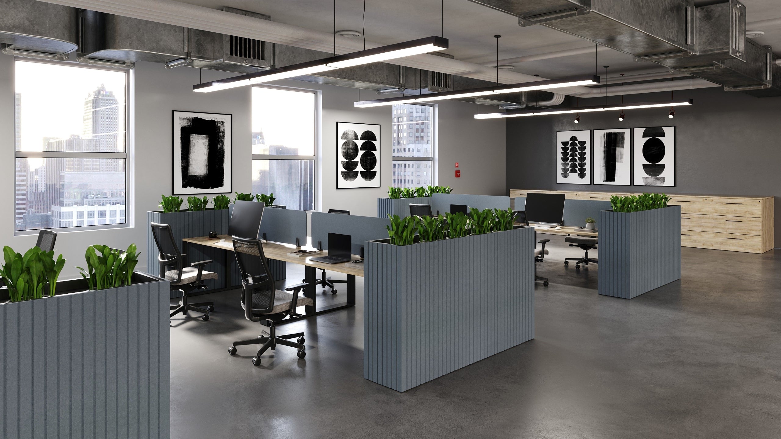 Modern office space with desks, chairs, and large windows.