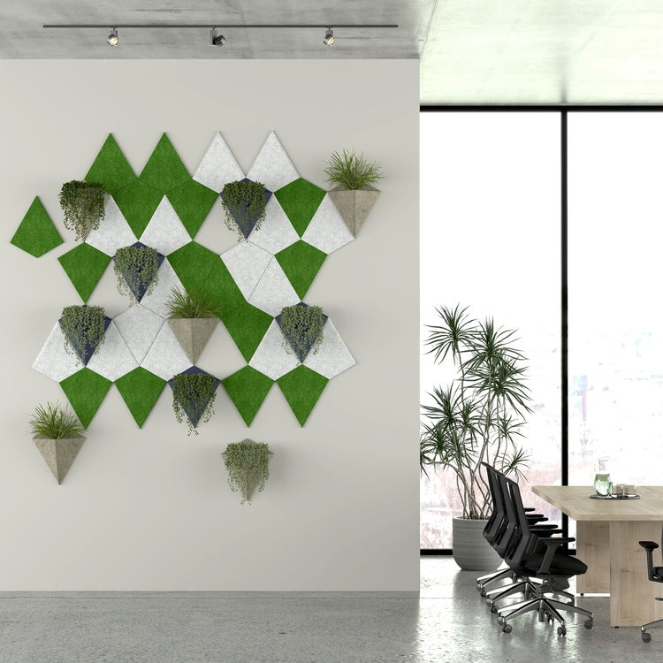 Geometric wall art with plants in a modern office setting