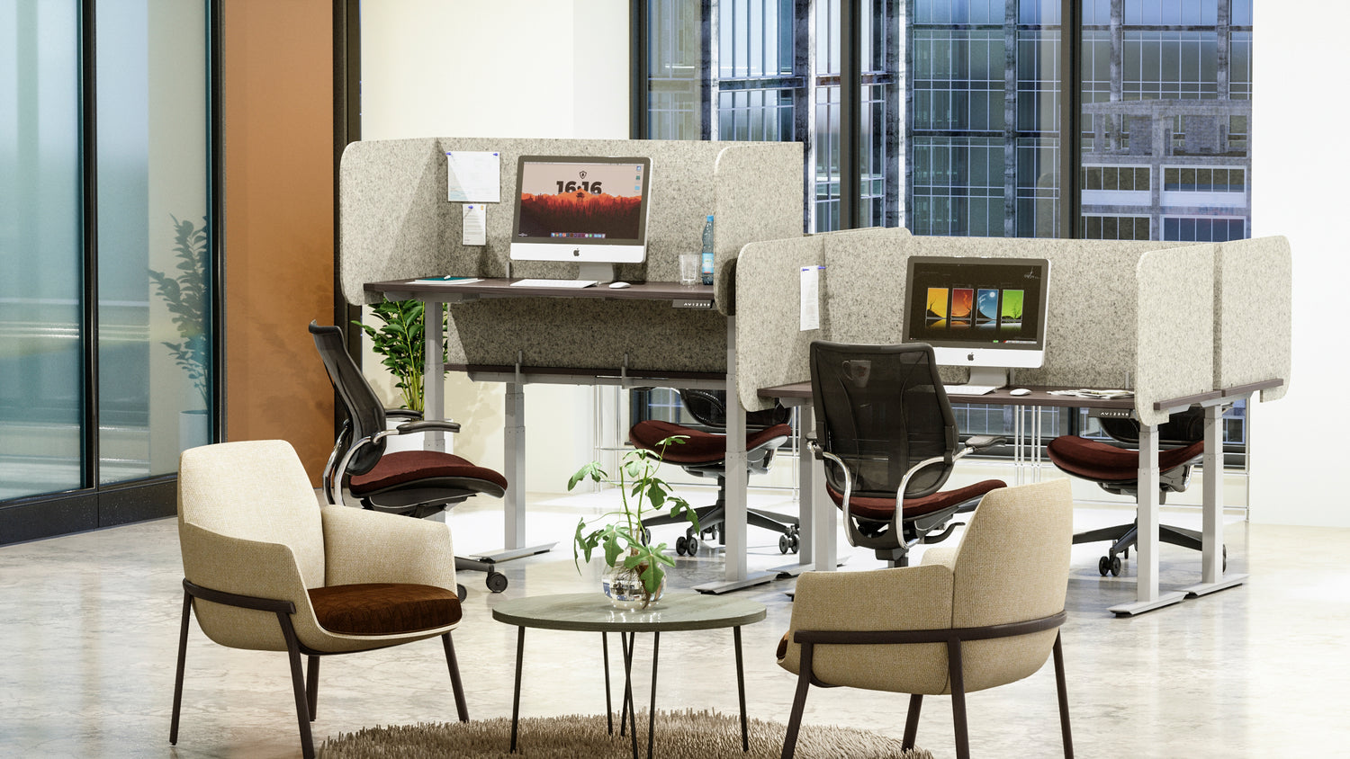 Modern office setup with desk chairs, tables, and computer monitors in a bright room.