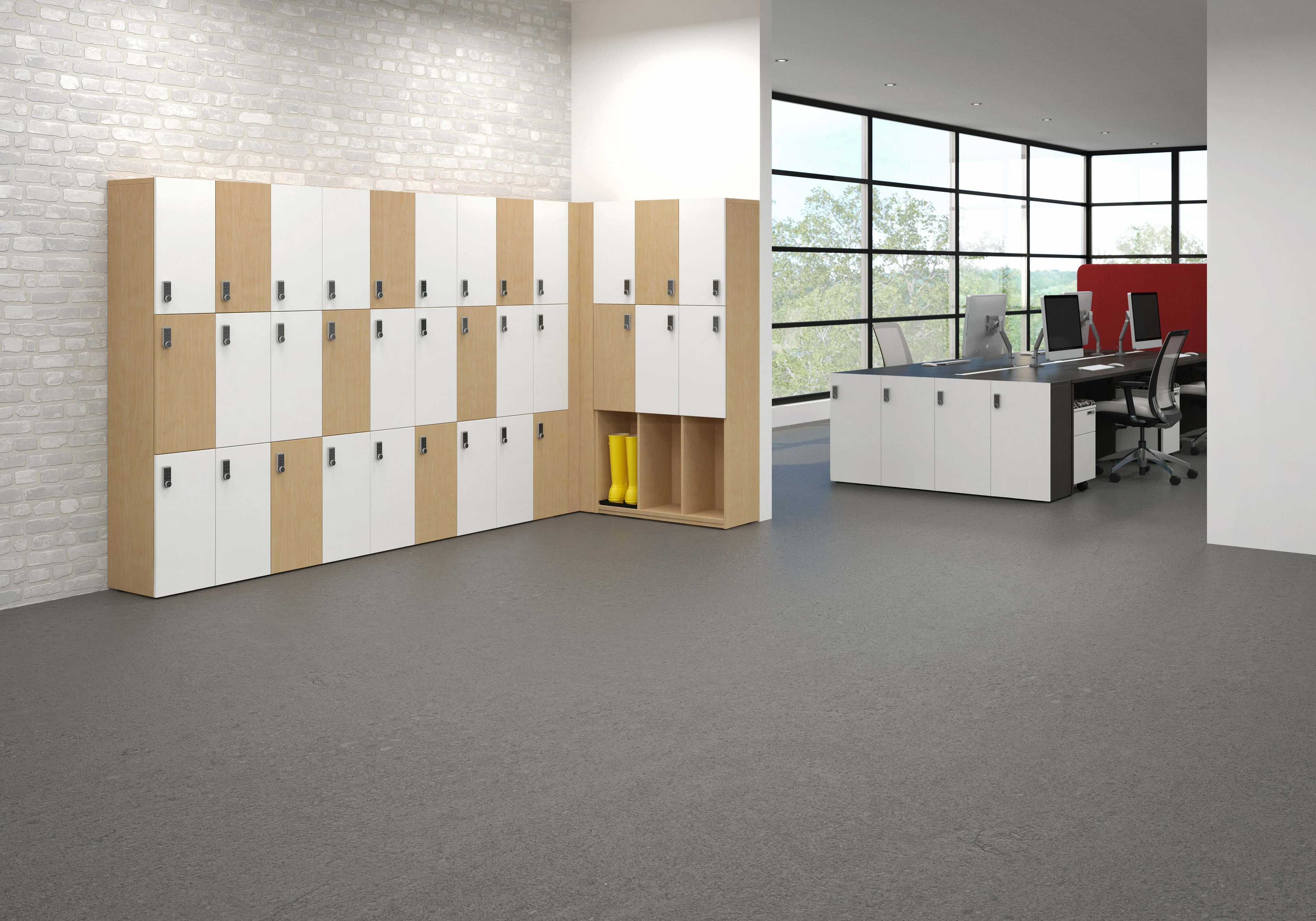 Modern office interior with lockers and a desk.