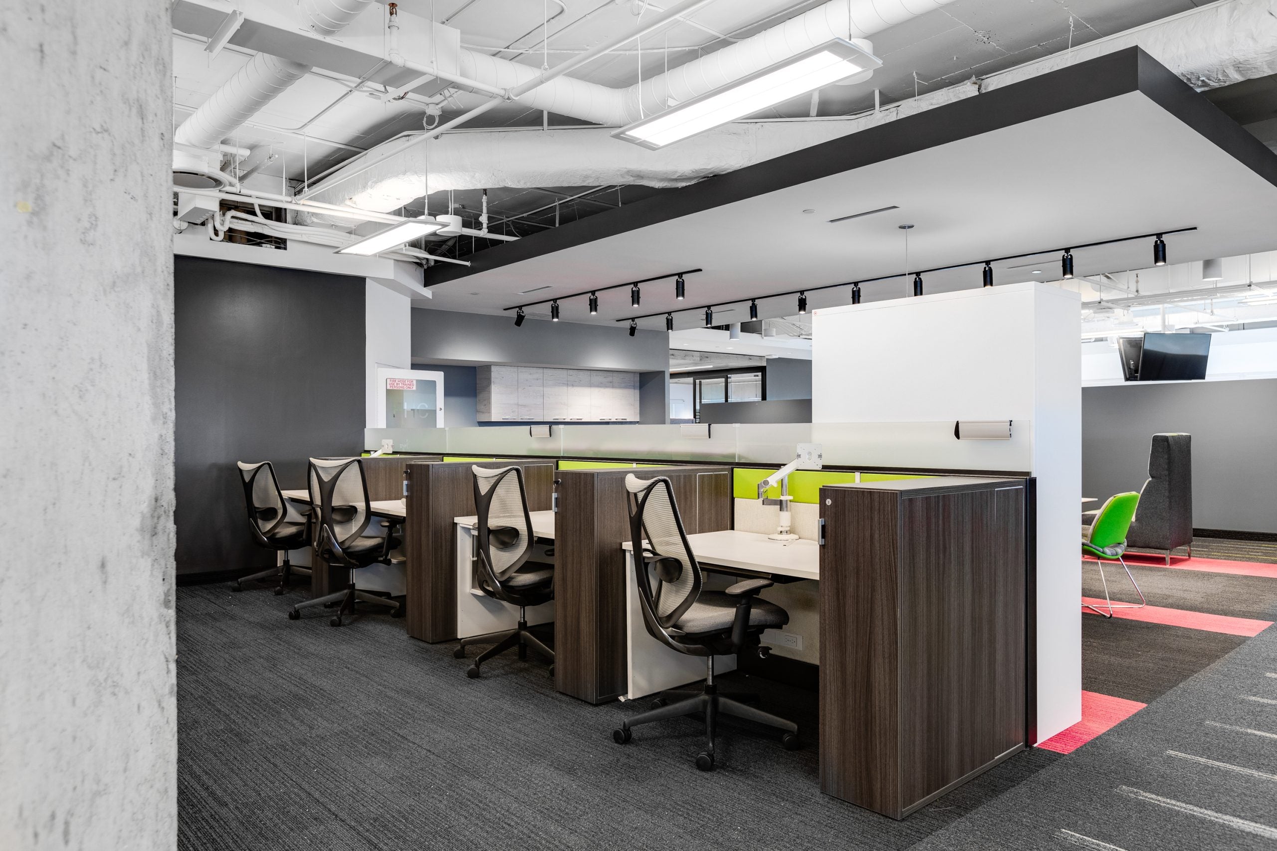 Modern office space with workstations and chairs